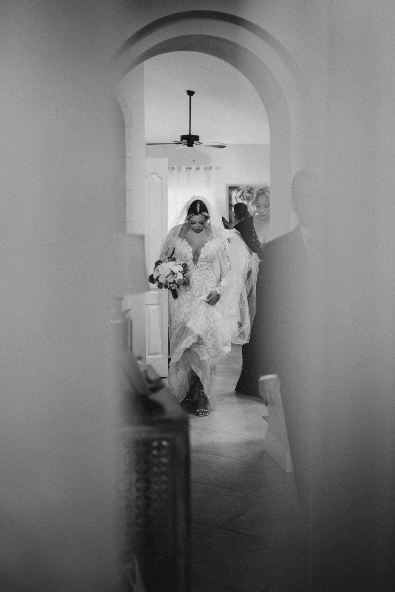 Bride entering the ceremony in a quiet black and white moment